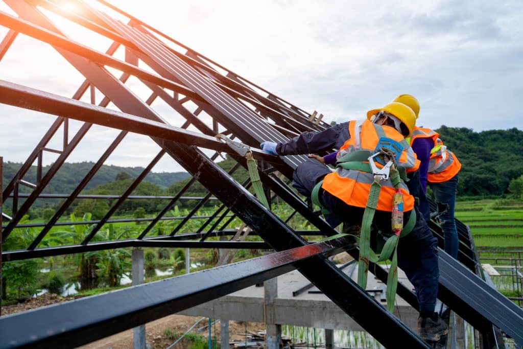 Roofer worker in protective uniform wear and gloves